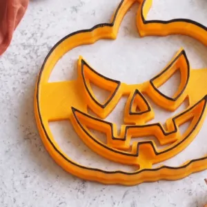 Pumpkin face fondant decoration made with Halloween cutter and stamp