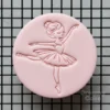 ballerina fondant cookie with embossed dancing girl design on biscuit