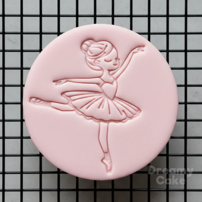 ballerina fondant cookie with embossed dancing girl design on biscuit
