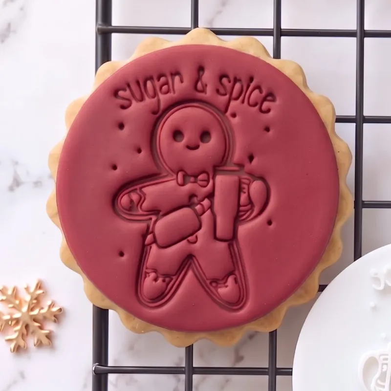 Gingerbread Cookie Stamp Sugar & Spice Christmas Fondant Embosser (2) Sugar and Spice gingerbread Christmas cookie stamp shown on a finished festive biscuit