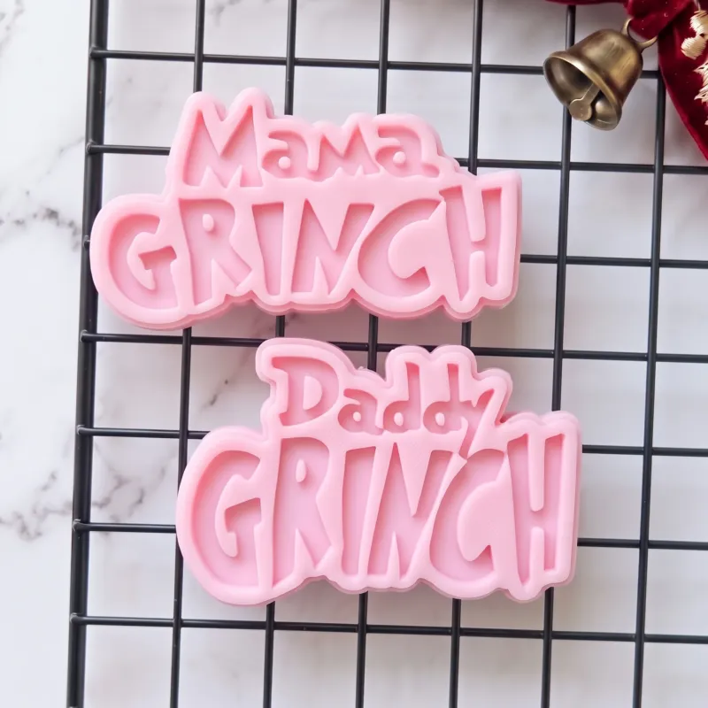 Mama and Daddy Christmas cookie stamp set shown on a finished festive biscuit