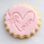 A cosy, affectionate design for all the mamas – this cookie stamp presses the word “Mama” with a small heart into fondant or sugar paste. Ideal for Mother’s Day, baby showers or first-time mum celebrations, it adds a soft, modern touch to biscuits, cupcakes and cakes. Lovely for matching sets with your other Mother’s Day stamps.