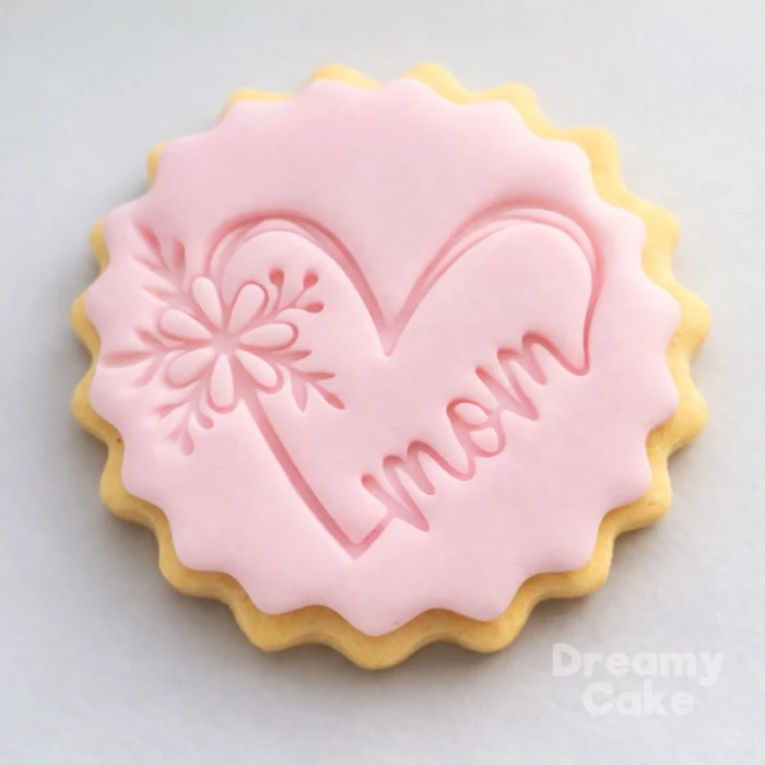 A cosy, affectionate design for all the mamas – this cookie stamp presses the word “Mama” with a small heart into fondant or sugar paste. Ideal for Mother’s Day, baby showers or first-time mum celebrations, it adds a soft, modern touch to biscuits, cupcakes and cakes. Lovely for matching sets with your other Mother’s Day stamps.