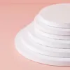 10-inch-round-cake-board-01.jpg (2) Stack of five white 12 inch round cake drum boards