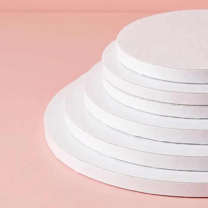 10-inch-round-cake-board-01.jpg (2) Stack of five white 12 inch round cake drum boards