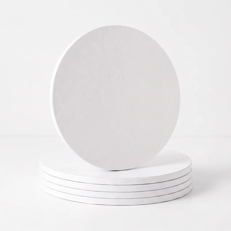 White 12 inch round cake drum board photographed from above